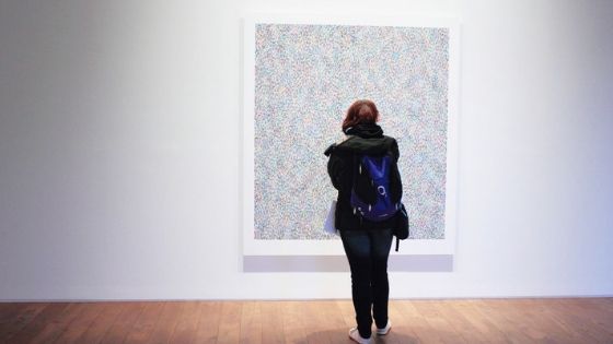 Woman looking at art